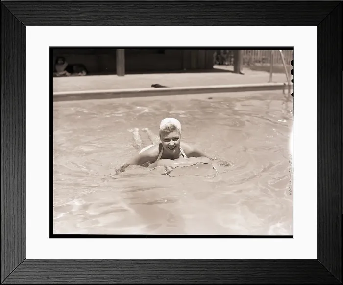 Framed Print : Woman in a Pool with an Air Mattress Framed Print : Woman in a Pool with an Air Mattress