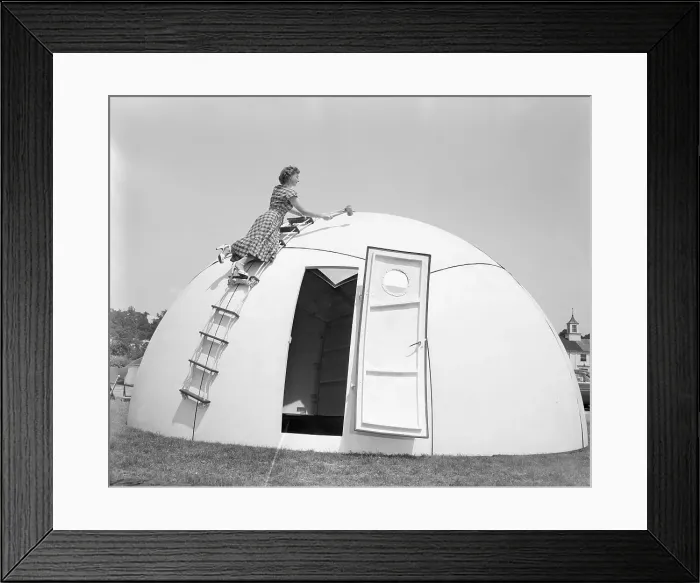 Framed Print : Woman Testing Portable Shelter Framed Print : Woman Testing Portable Shelter