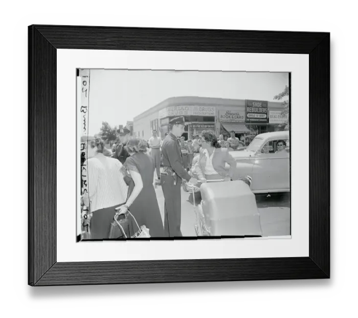Framed Print : Policeman Confronting Women One on One