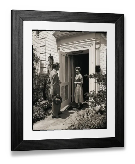 Framed Print : Woman Greeting Man at Door Framed Print : Woman Greeting Man at Door