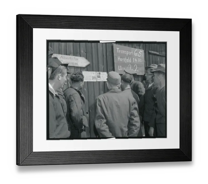 Framed Print : Returning POWs Viewing Photos of Comrades Framed Print : Returning POWs Viewing Photos of Comrades