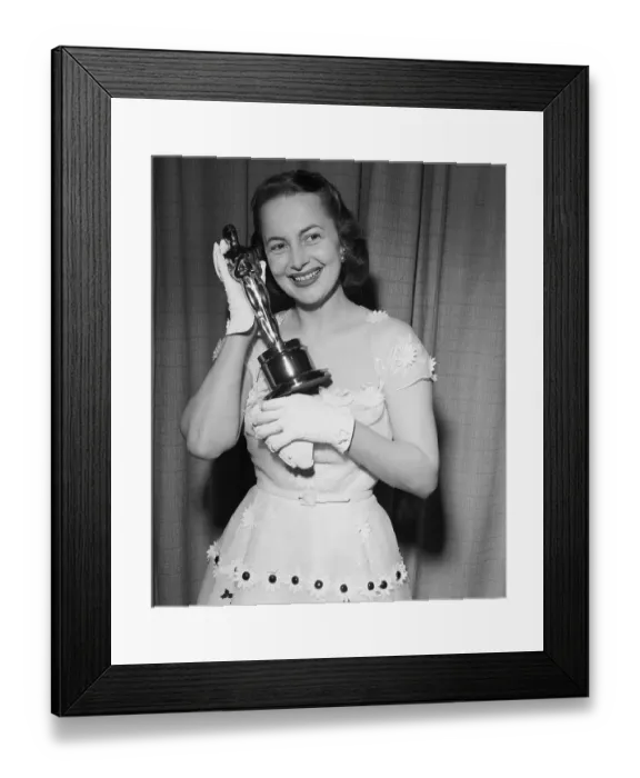 Framed Print : Olivia De Havilland Holding Her Oscar Framed Print : Olivia De Havilland Holding Her Oscar
