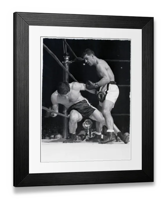 Framed Print : Rocky Marciano Punching Boxer in Corner Framed Print : Rocky Marciano Punching Boxer in Corner