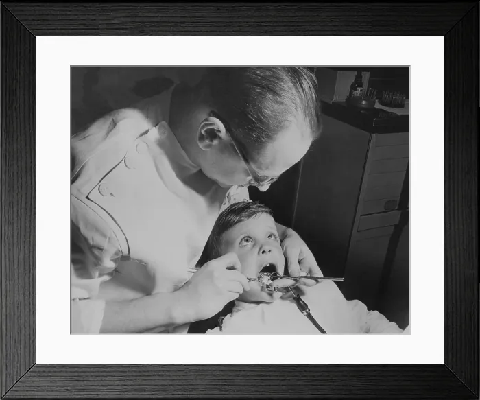 Framed Print : Dentists Working on Child Framed Print : Dentists Working on Child
