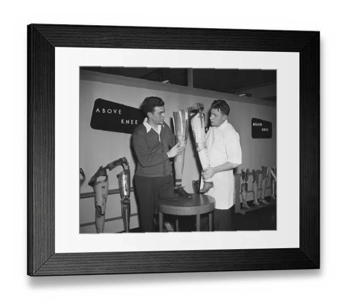 Framed Print : Men Looking At Prosthetic Legs Framed Print : Men Looking At Prosthetic Legs