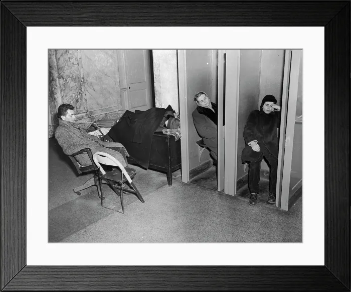 Framed Print : People Sleeping in Lobby Phone Booths