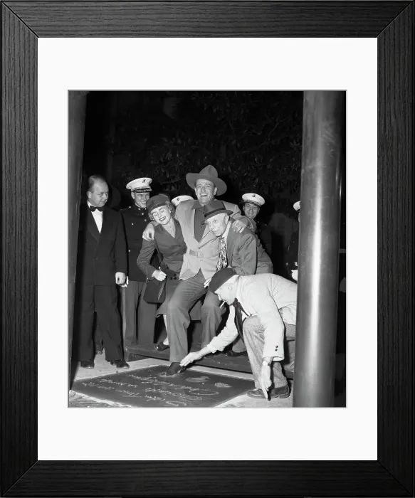 Framed Print : John Wayne Puts His Foot Into Cement Framed Print : John Wayne Puts His Foot Into Cement