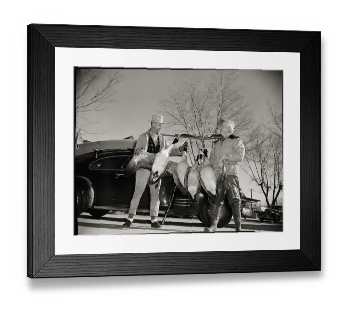Framed Print : Hunters with Geese Hanging from Rifle Framed Print : Hunters with Geese Hanging from Rifle