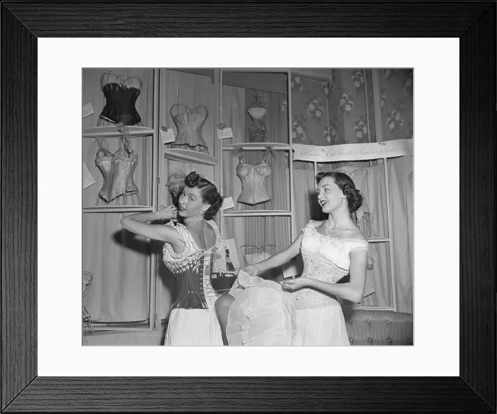 Framed Print : Woman Helps Other Woman Lace Corset Framed Print : Woman Helps Other Woman Lace Corset