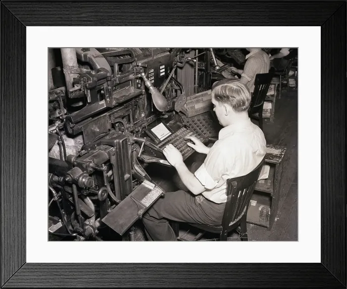 Framed Print : Linotype Operator Seated Working Framed Print : Linotype Operator Seated Working