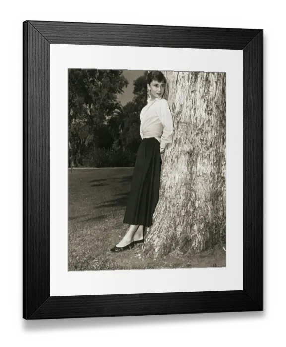 Framed Print : Audrey Hepburn Leaning on Tree Trunk Framed Print : Audrey Hepburn Leaning on Tree Trunk