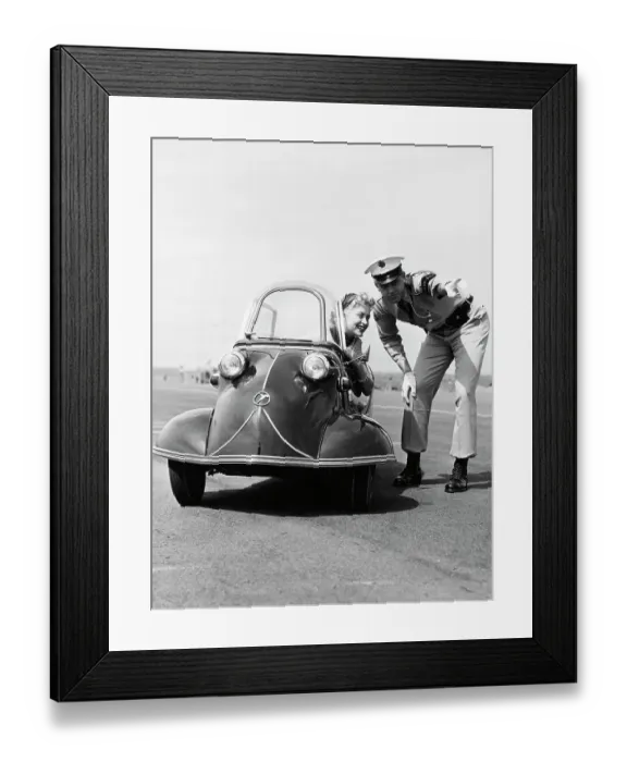Framed Print : Policeman Directing Young Woman in Three-Wheel Car Framed Print : Policeman Directing Young Woman in Three-Wheel Car