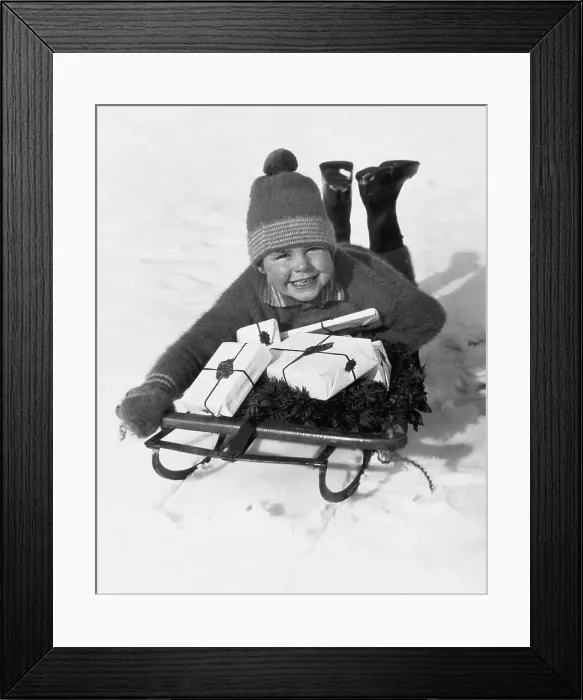 Framed Print : Boy on Sled with Christmas Gifts Framed Print : Boy on Sled with Christmas Gifts