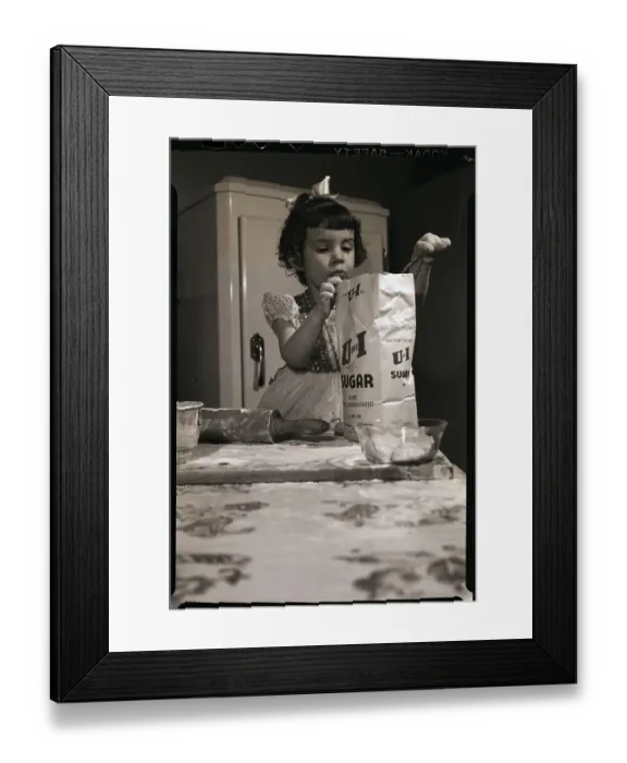 Framed Print : Little Girl Scooping Sugar for Baking Framed Print : Little Girl Scooping Sugar for Baking