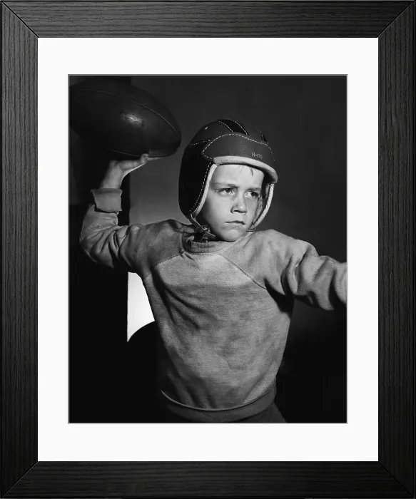 Framed Print : Boy Throwing a Football Framed Print : Boy Throwing a Football