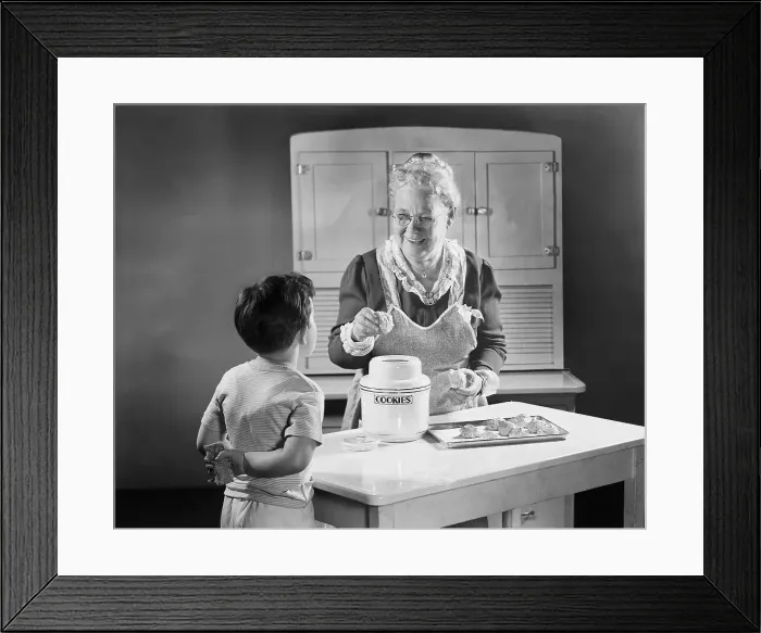 Framed Print : Grandmotherly Woman Making Cookies for a Boy