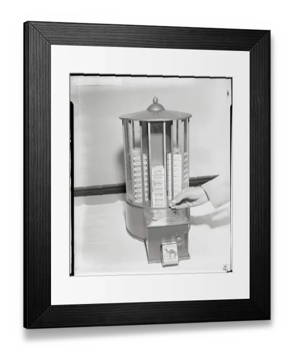 Framed Print : Man's Hand Holding Slug in Front of Cigarette Machine Framed Print : Man's Hand Holding Slug in Front of Cigarette Machine