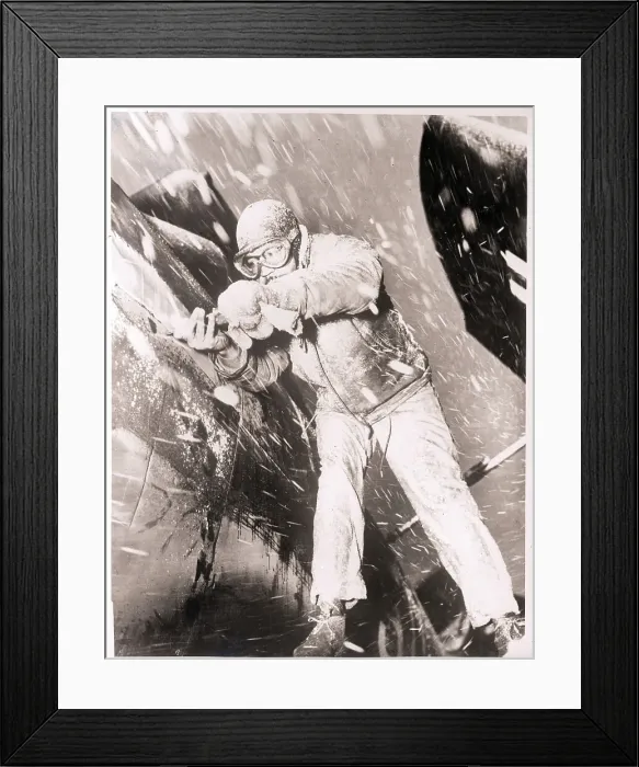 Framed Print : Mechanic Working on Plane in Snowstorm Framed Print : Mechanic Working on Plane in Snowstorm