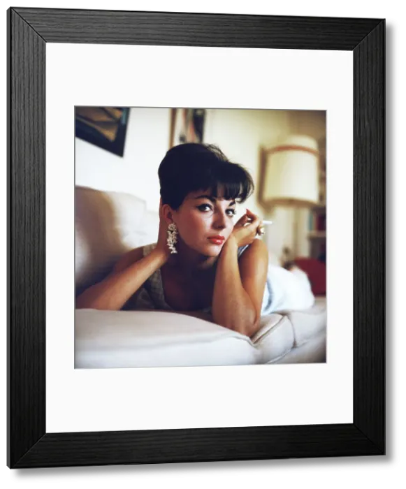 Framed Print : Actress Joan Collins Reclining with Cigarette