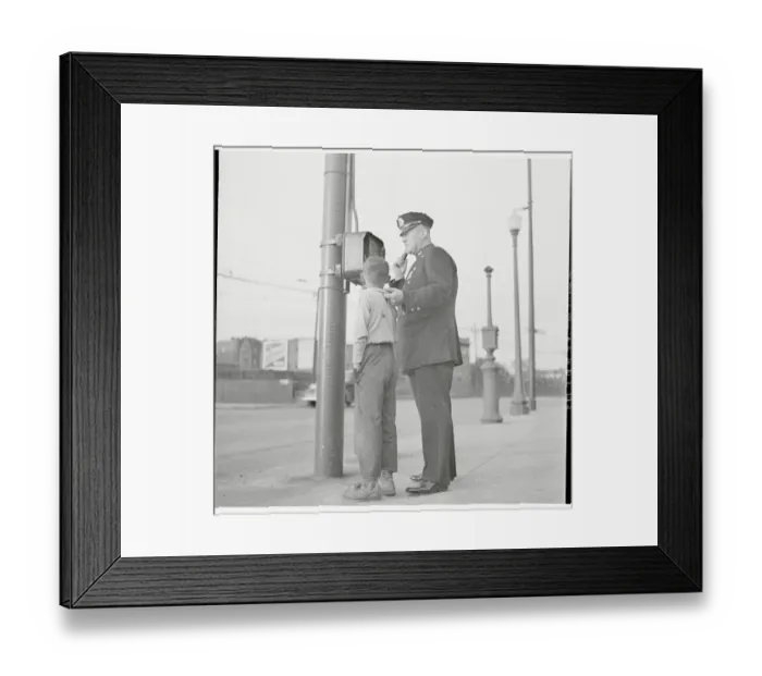 Framed Print : Police Using Telephone with Young Suspect in Tow Framed Print : Police Using Telephone with Young Suspect in Tow