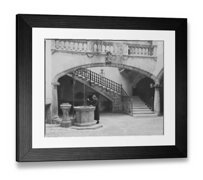 Framed Print : Woman Working in Courtyard