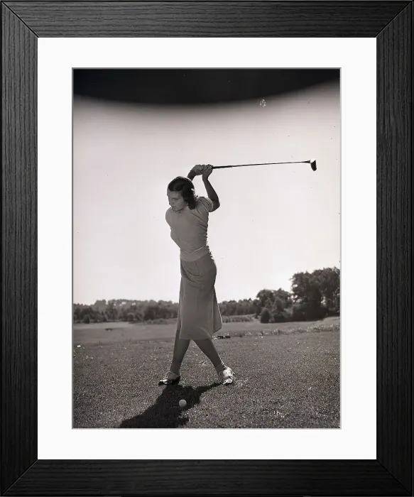 Framed Print : Woman Swinging a Golf Club Framed Print : Woman Swinging a Golf Club
