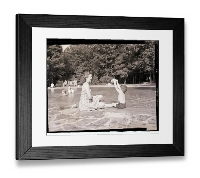 Framed Print : Mother and Son Playing Beside Wading Pool Framed Print : Mother and Son Playing Beside Wading Pool