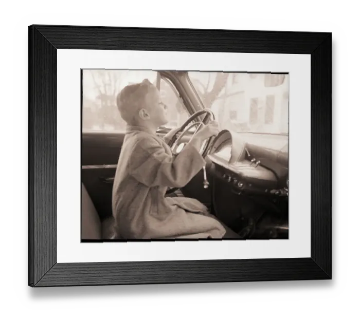 Framed Print : Boy at Wheel of Auto