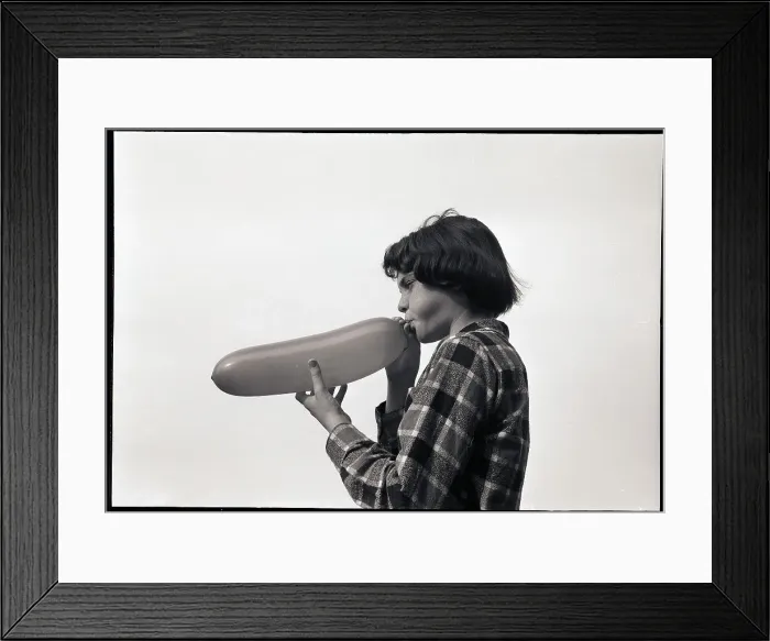 Framed Print : Girl Blowing a Balloon Framed Print : Girl Blowing a Balloon