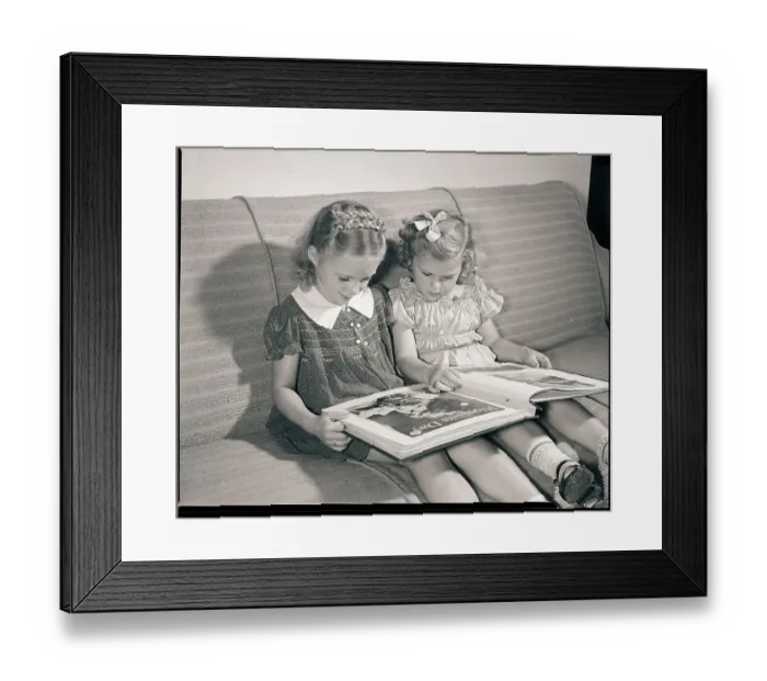 Framed Print : Young Sisters Reading