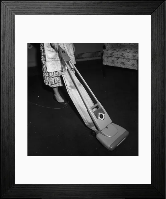Framed Print : Woman Vacuuming Framed Print : Woman Vacuuming