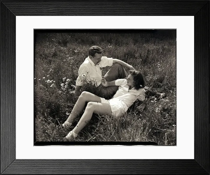 Framed Print : Couple Lying in Field Framed Print : Couple Lying in Field