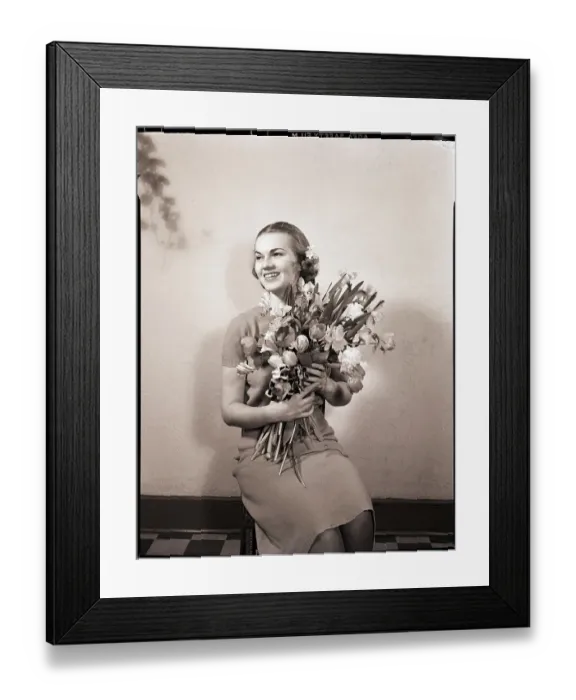 Framed Print : Smiling Woman Holding Flowers