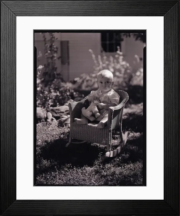 Framed Print : Baby Seating in Wicker Chair Framed Print : Baby Seating in Wicker Chair