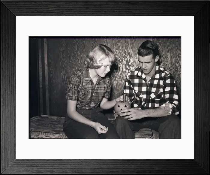 Framed Print : Teenagers Lighting Jack-O'-Lantern Candle Framed Print : Teenagers Lighting Jack-O'-Lantern Candle