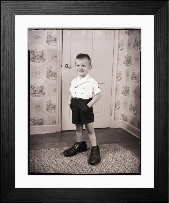Framed Print : Boy Standing in Oversized Shoes Framed Print : Boy Standing in Oversized Shoes