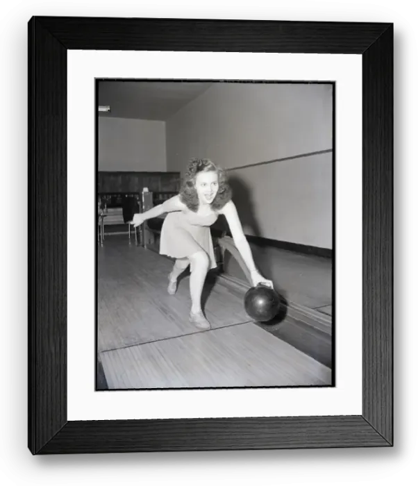 Framed Print : Young Woman Bowling Framed Print : Young Woman Bowling