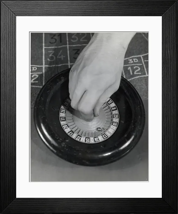 Framed Print : Hand Spinning Miniature Roulette Wheel Framed Print : Hand Spinning Miniature Roulette Wheel