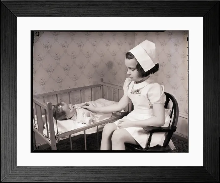Framed Print : Girl Playing Nurse Framed Print : Girl Playing Nurse