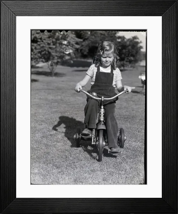 Framed Print : Girl Riding a Tricycle