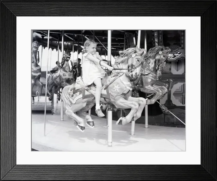 Framed Print : Girl Riding a Carousel Framed Print : Girl Riding a Carousel