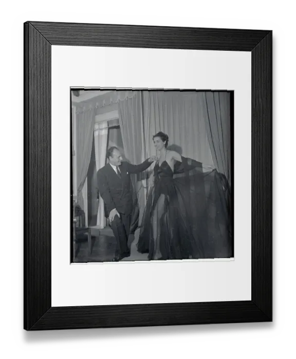 Framed Print : Pierre Balmain Adjusting Shoulder Strap of Model Framed Print : Pierre Balmain Adjusting Shoulder Strap of Model