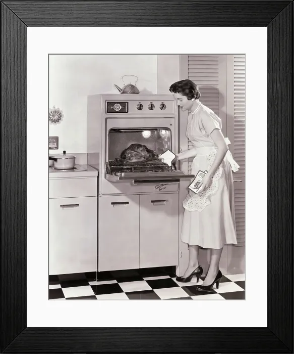 Framed Print : Woman Demonstrating Modern Oven for Cooking Framed Print : Woman Demonstrating Modern Oven for Cooking