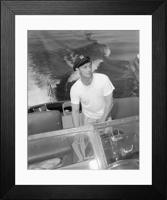 Framed Print : Robert Mitchum Driving a Motorboat Framed Print : Robert Mitchum Driving a Motorboat