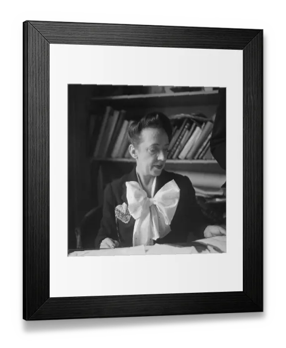 Framed Print : Elsa Schiaparelli Sitting in Front of Bookshelf Framed Print : Elsa Schiaparelli Sitting in Front of Bookshelf