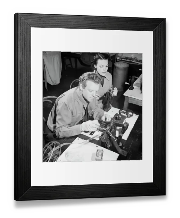 Framed Print : Movie Star Splicing Film with Assistant Framed Print : Movie Star Splicing Film with Assistant