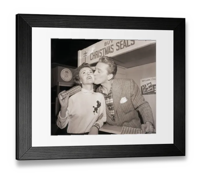 Framed Print : Kirk Douglas Kissing a Seal Customer Framed Print : Kirk Douglas Kissing a Seal Customer
