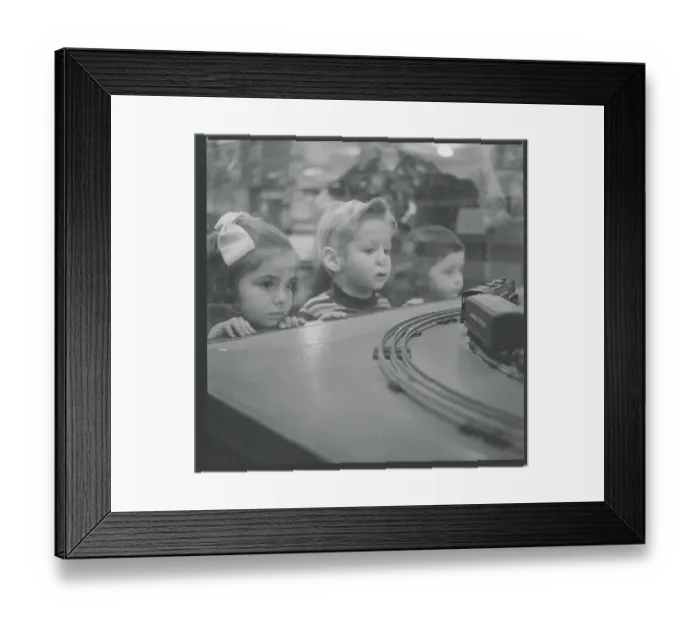Framed Print : Children Admiring Electric Train Framed Print : Children Admiring Electric Train