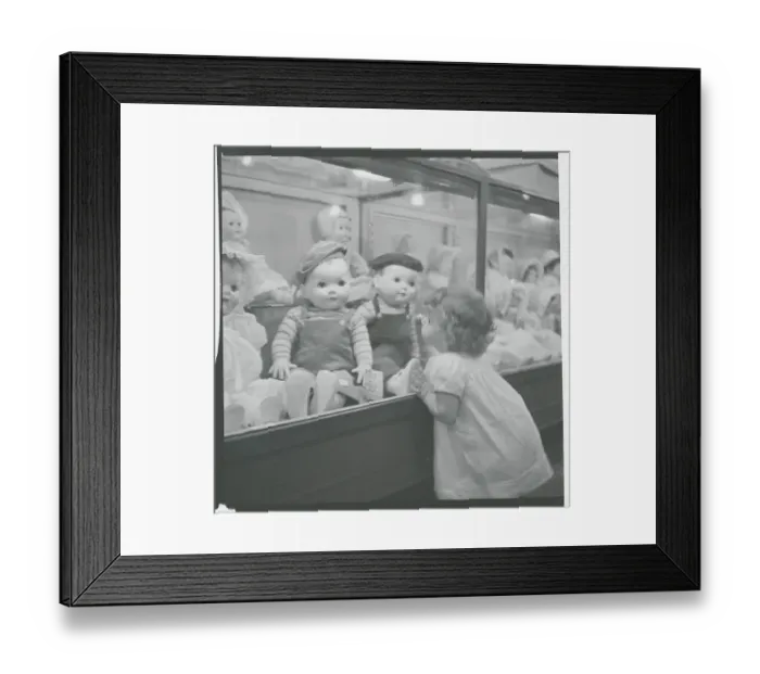 Framed Print : Little Girl Longing for Dolls Framed Print : Little Girl Longing for Dolls