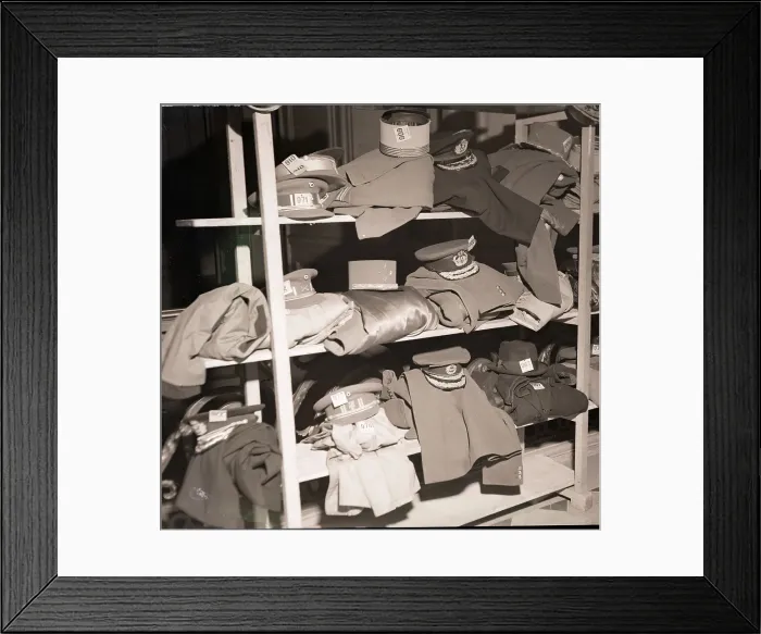 Framed Print : French Military Uniforms on Shelves